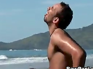 Sweaty, gonzo queer fucking as two Brazilian guys get active on the beach