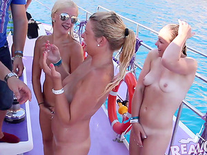 Super-cute soiree ladies on a boat flashing their tits for the camera